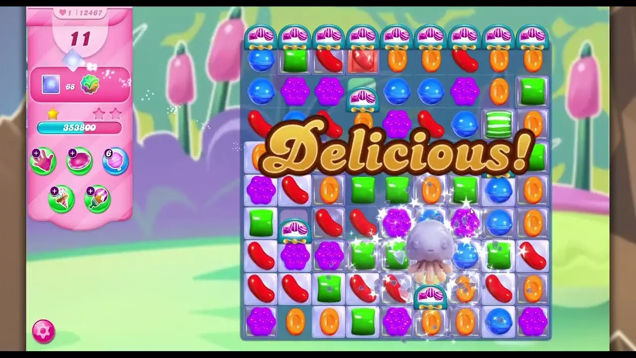 A screenshot of Candy Crush Saga with the word "Delicious" on screen.