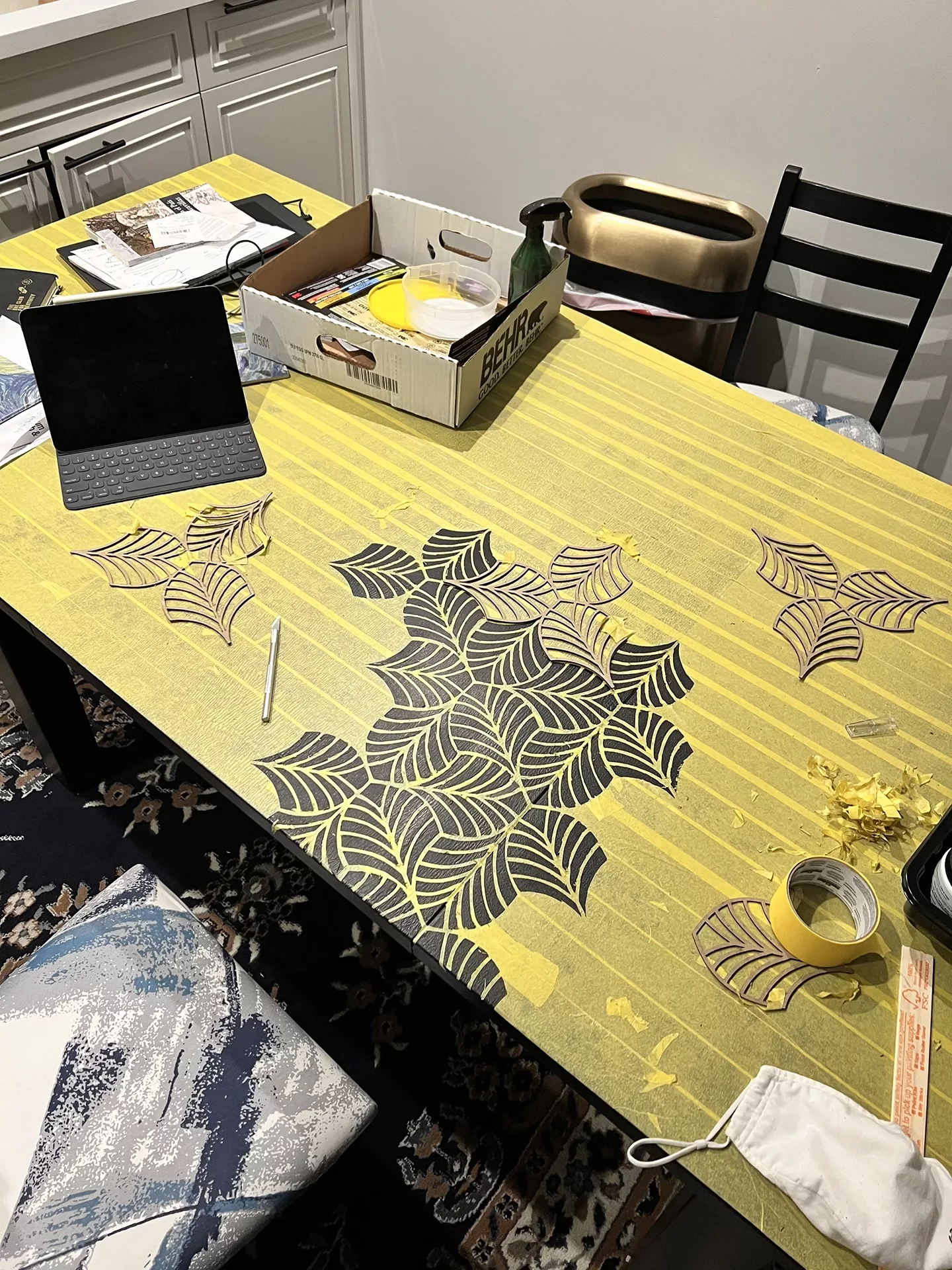 An in progress shot of our Tessellation Tafel. We used an exacto knife to cut through tape to produce the pattern.
