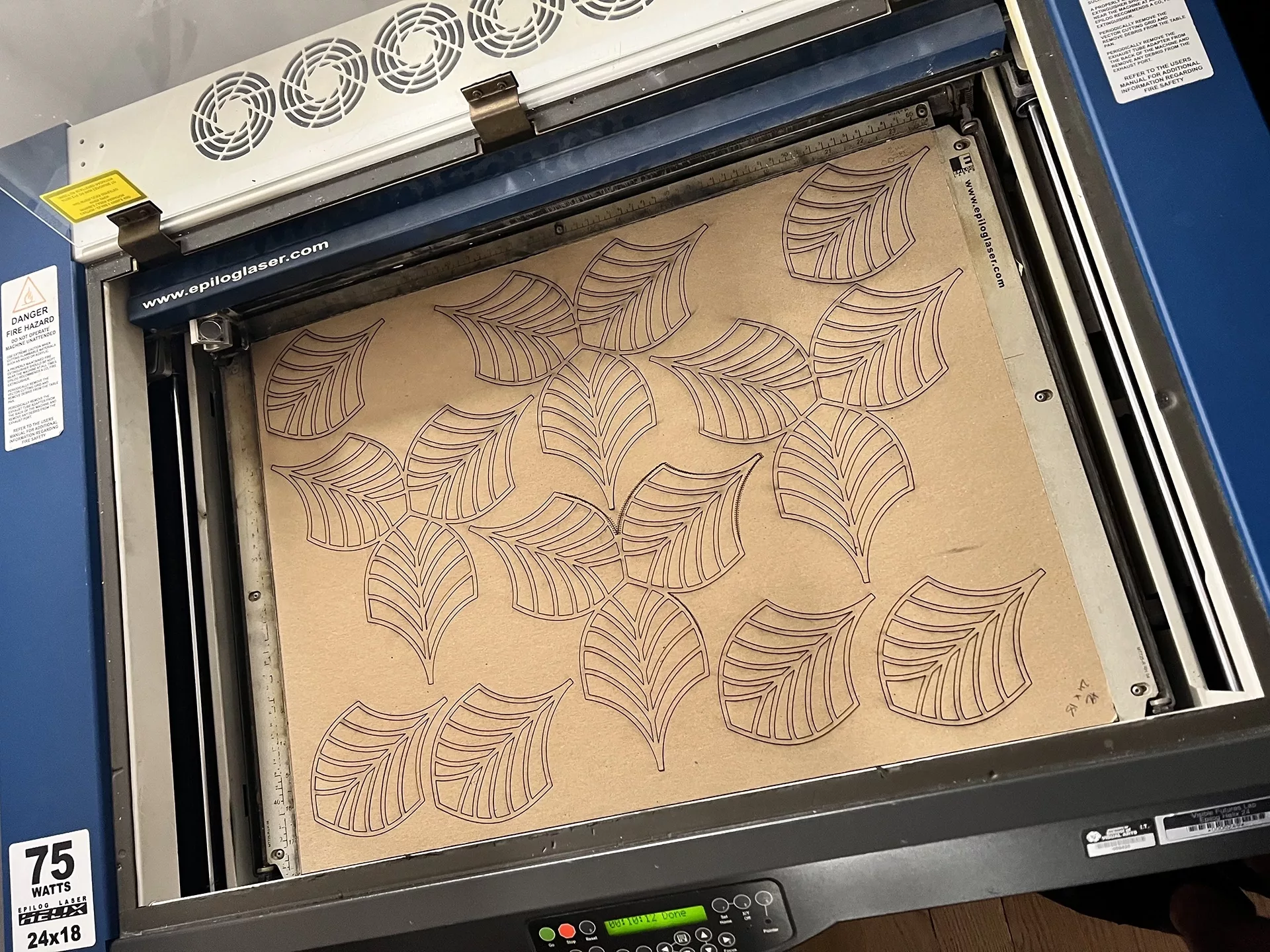 The MDF leaves in the laser cutter.