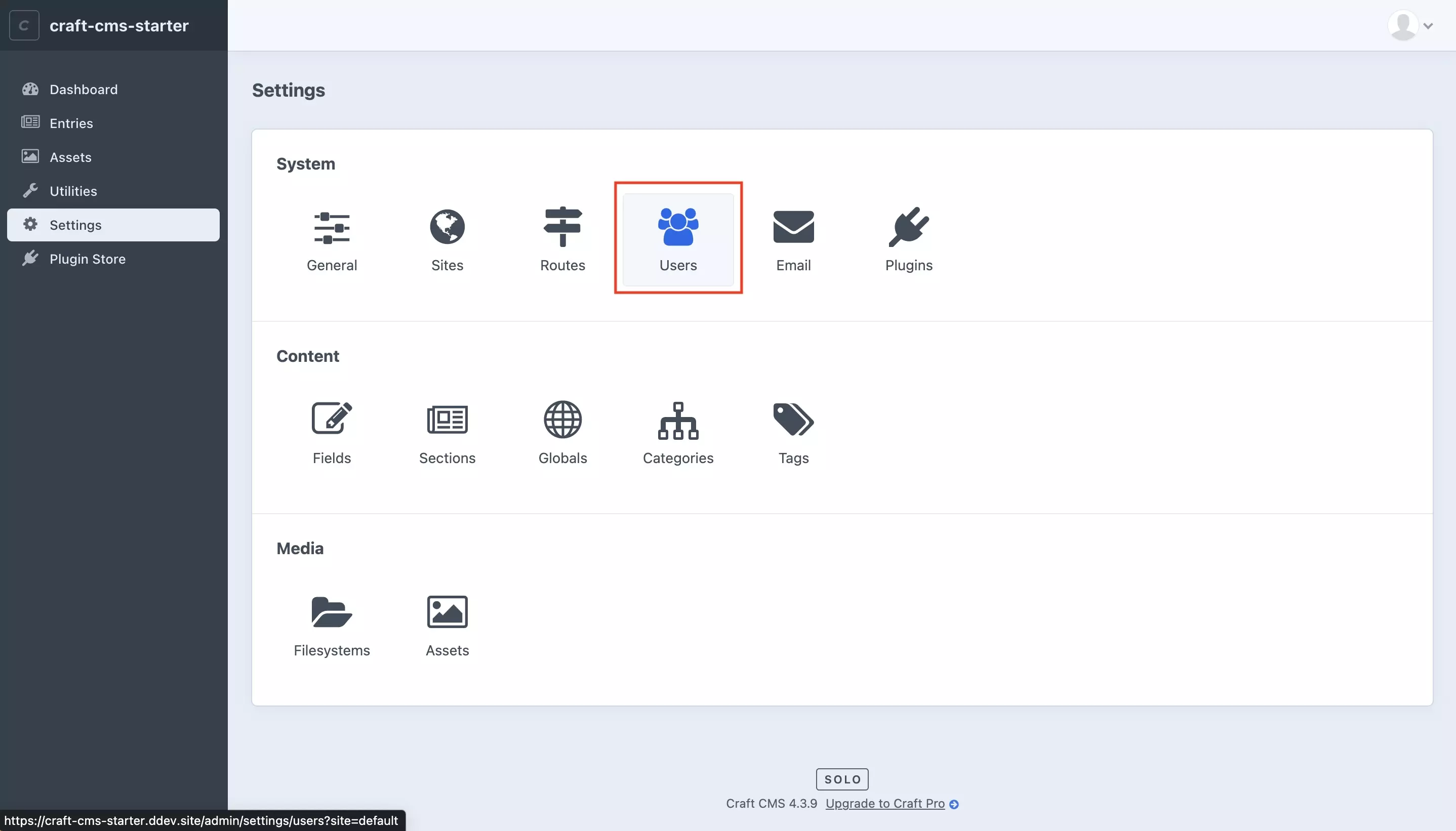 A screenshot of the Craft CMS Settings Page. Highlighted is the Users tile under System. Press it and move on to the next step.