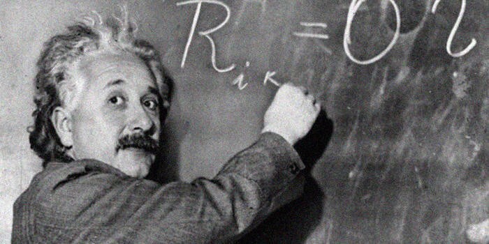 Einstein drawing on a chalkboard.